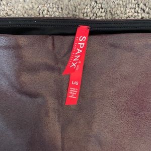 Used Spanx Faux Leather Leggings size Large. Wine color. Only worn 1-2 times.